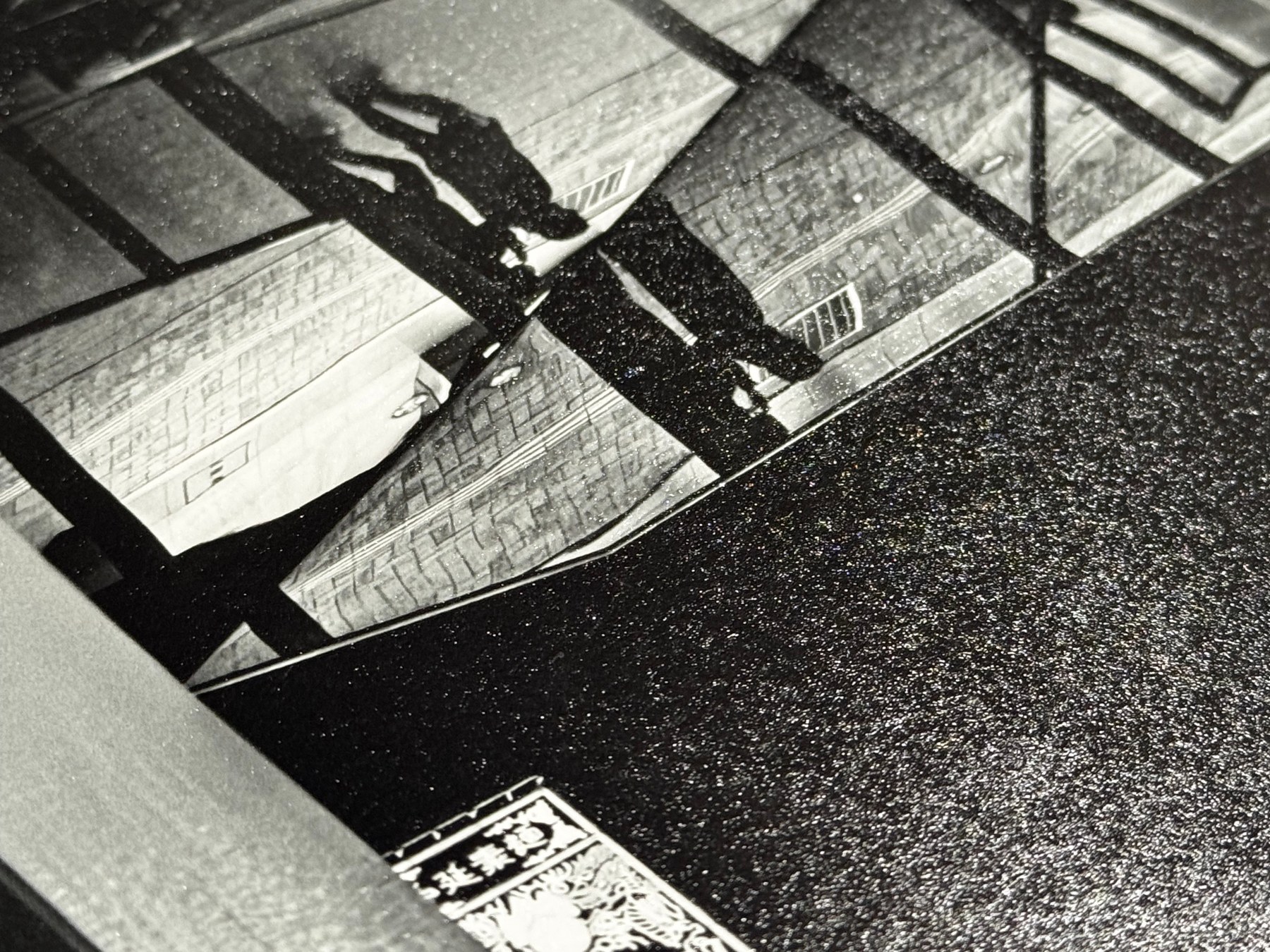 A photographic print being finished by the artist.