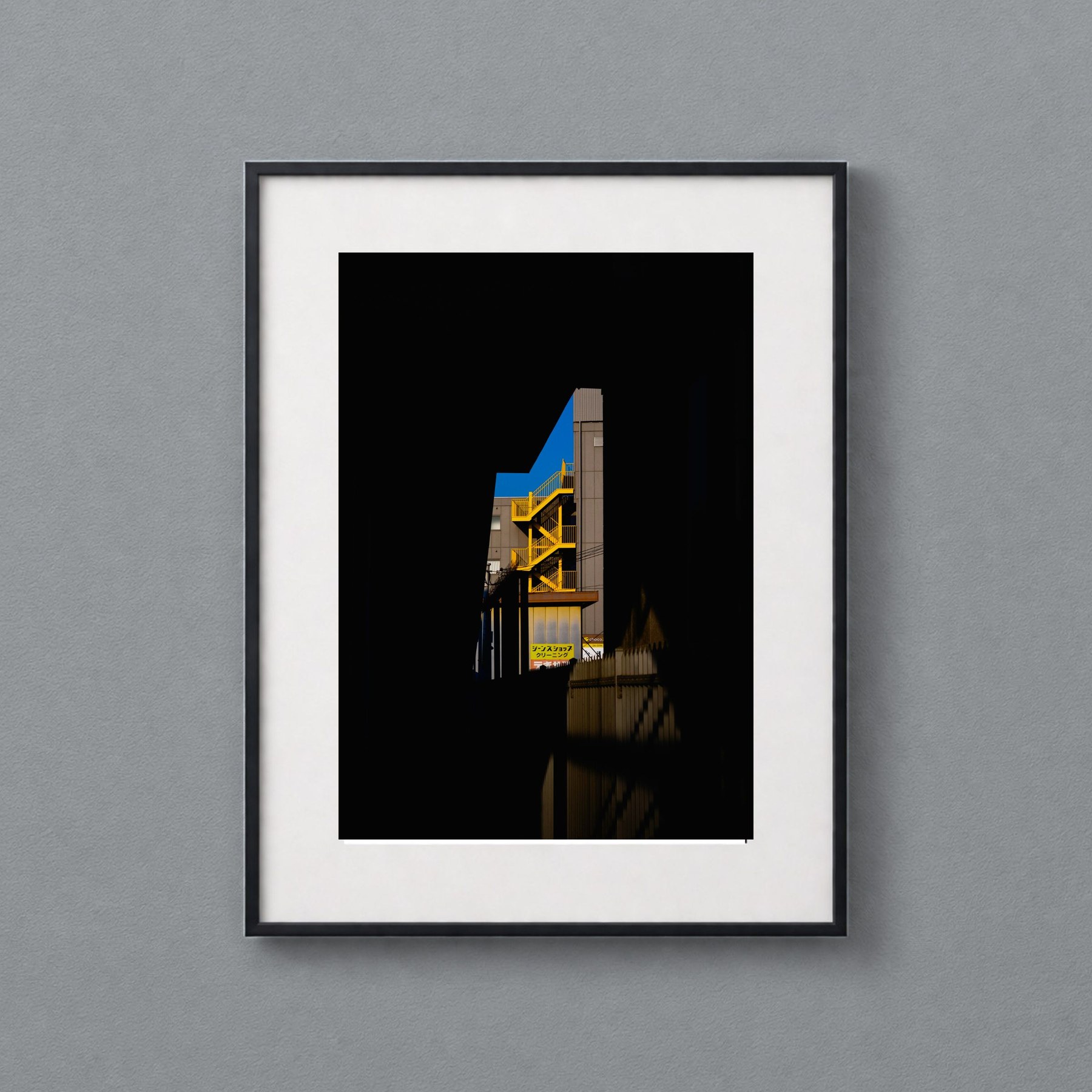 Fresh shown in a black frame against a grey wall.